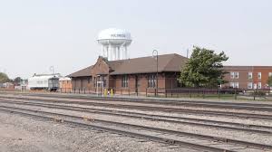 Historic Holdrege train depot with railroad tracks